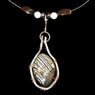 Zebra jasper on recycled guitar string